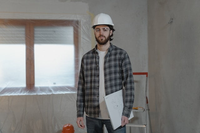 Home inspector standing inside a house.